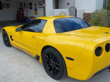 Ceramic tint Solar UV tint applied to a yellow sports car
