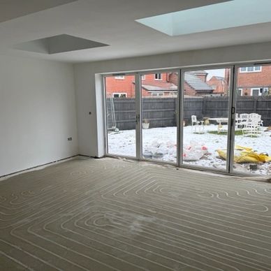 Retrofit underfloor heating milled into concrete subfloor at Lichfield kitchen extension project