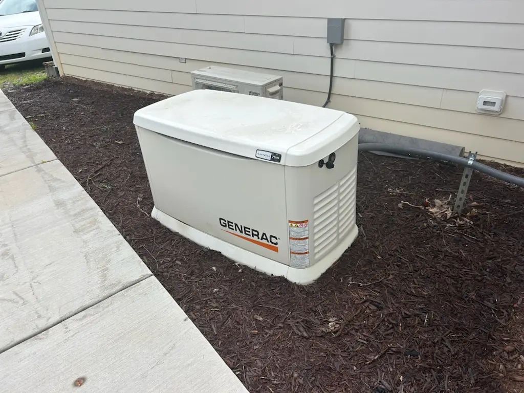 Generac standby generator outside a house.