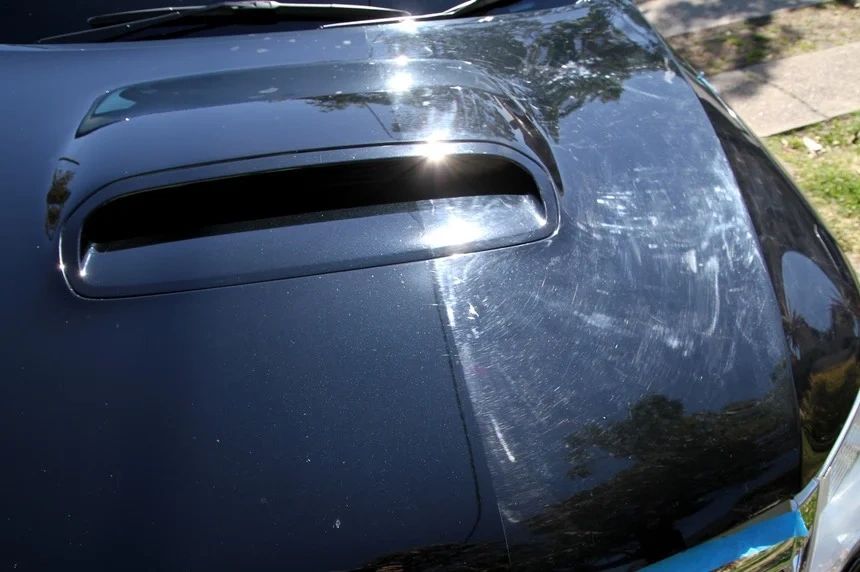 Swirl marks on black paint before and after two step paint correction in Bentonville AR