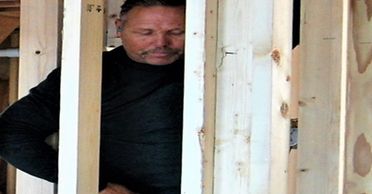construction worker framing interior wall