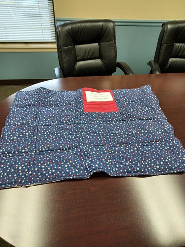 Blue fabric with star patterns on a table.