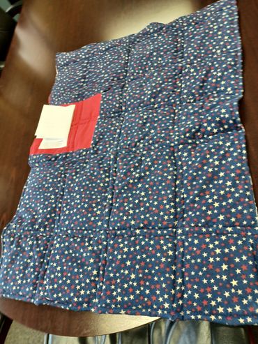 Star-patterned navy blue fabric with two red patches.