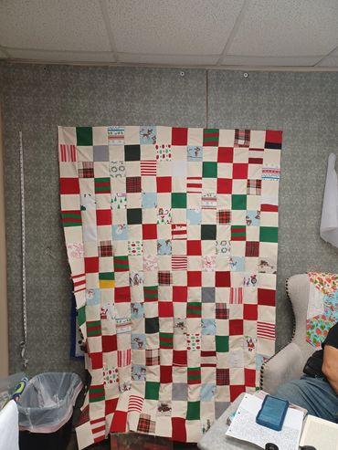 Quilts were made for 3 siblings and the parents out of 25 years of matching Christmas pajamas