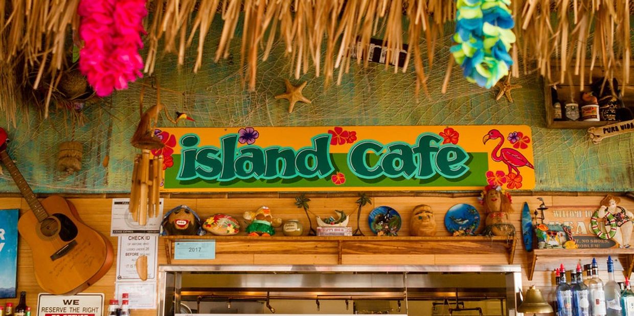 island cafe sign and counter with shelves
