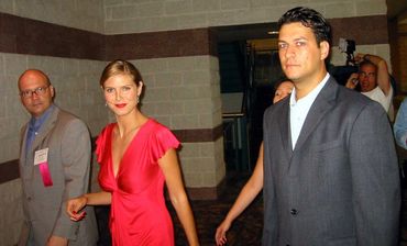 Lou Dottoli walking with Heidi Klum and another man