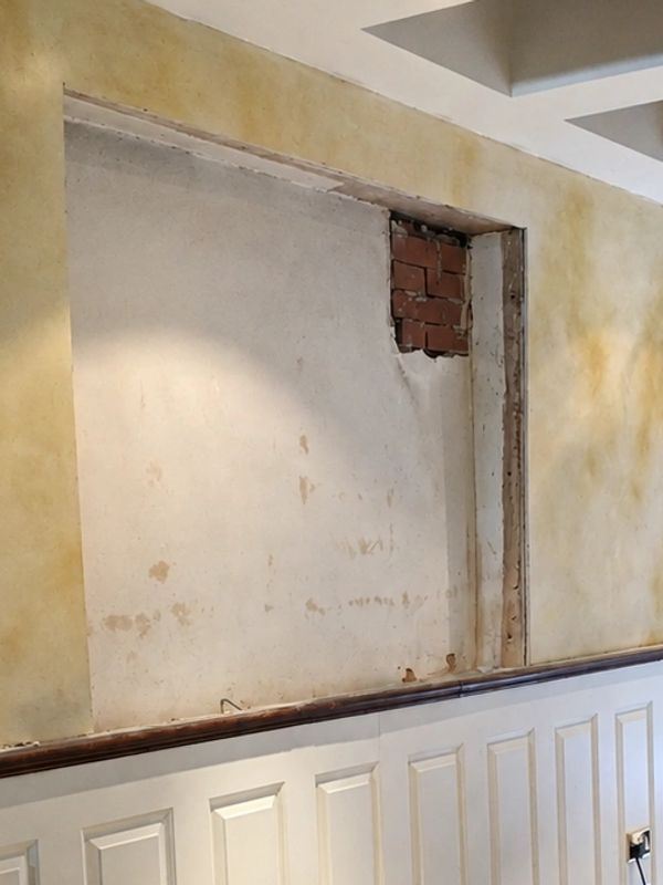 Bespoke built in shelving and storage unit being fitted into an alcove in Scarborough, Filey