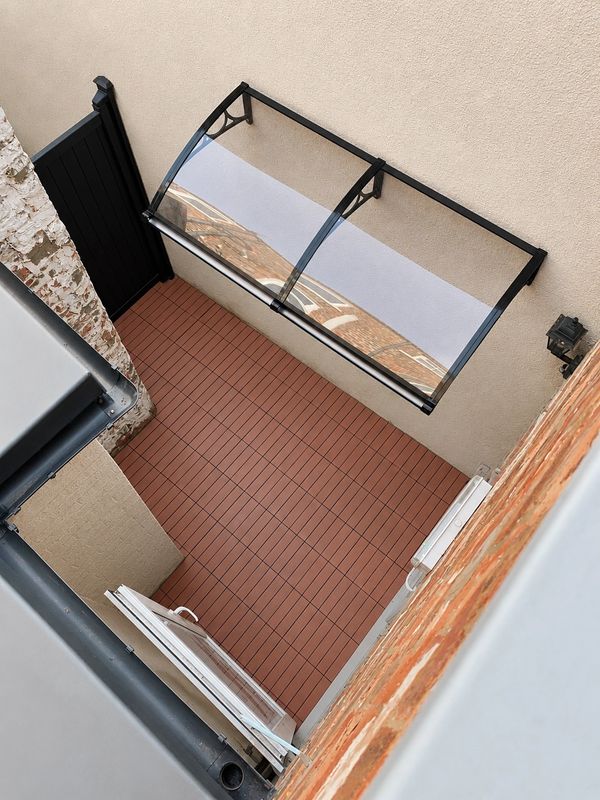 Overhead view of completed aluminium gate, canopy roof and composite floor tiles in Scarborough,