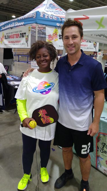 Pickleball Pro Rob Cassidy and fan. Slam Master Pro booth. Atlantic City Open. Pickleball Galaxy