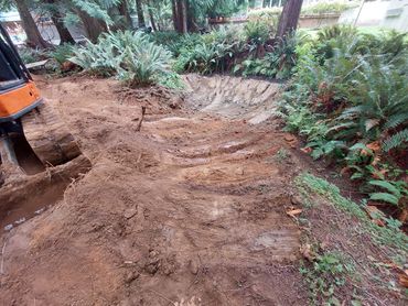 Small pond with excavator under construction