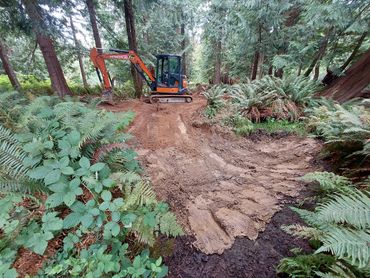 Small pond with excavator under construction