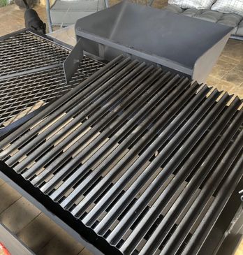 Argentine style grate with catch basin for true Argentine style cooking. Steaks, chops and chicken are amazing cooked over wood with this grill.