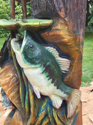 A Bass about to eat a frog.
