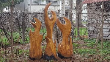 abstract fire chainsaw sculpture in pine