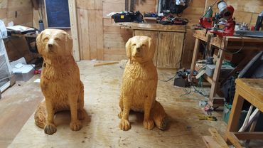 chainsaw carved spiritual guardian dogs