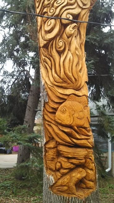 air, fire water earth chainsaw carving