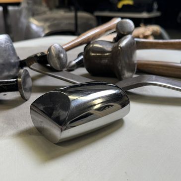 Hammer and dollies used for automotive restoration. Metal work