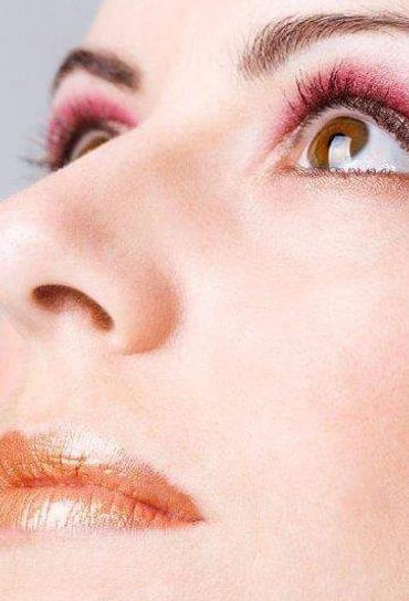 Close-up of woman's face with makeup.