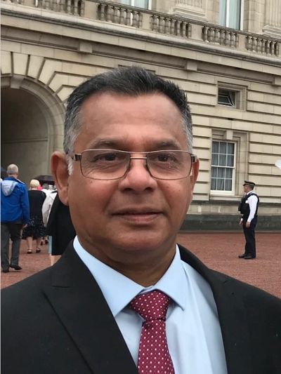 a smiling man looking at the camera