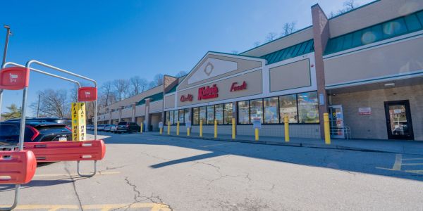 Exterior of a grocery store with shopping carts.