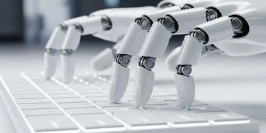 Robotic hands typing on a white keyboard.