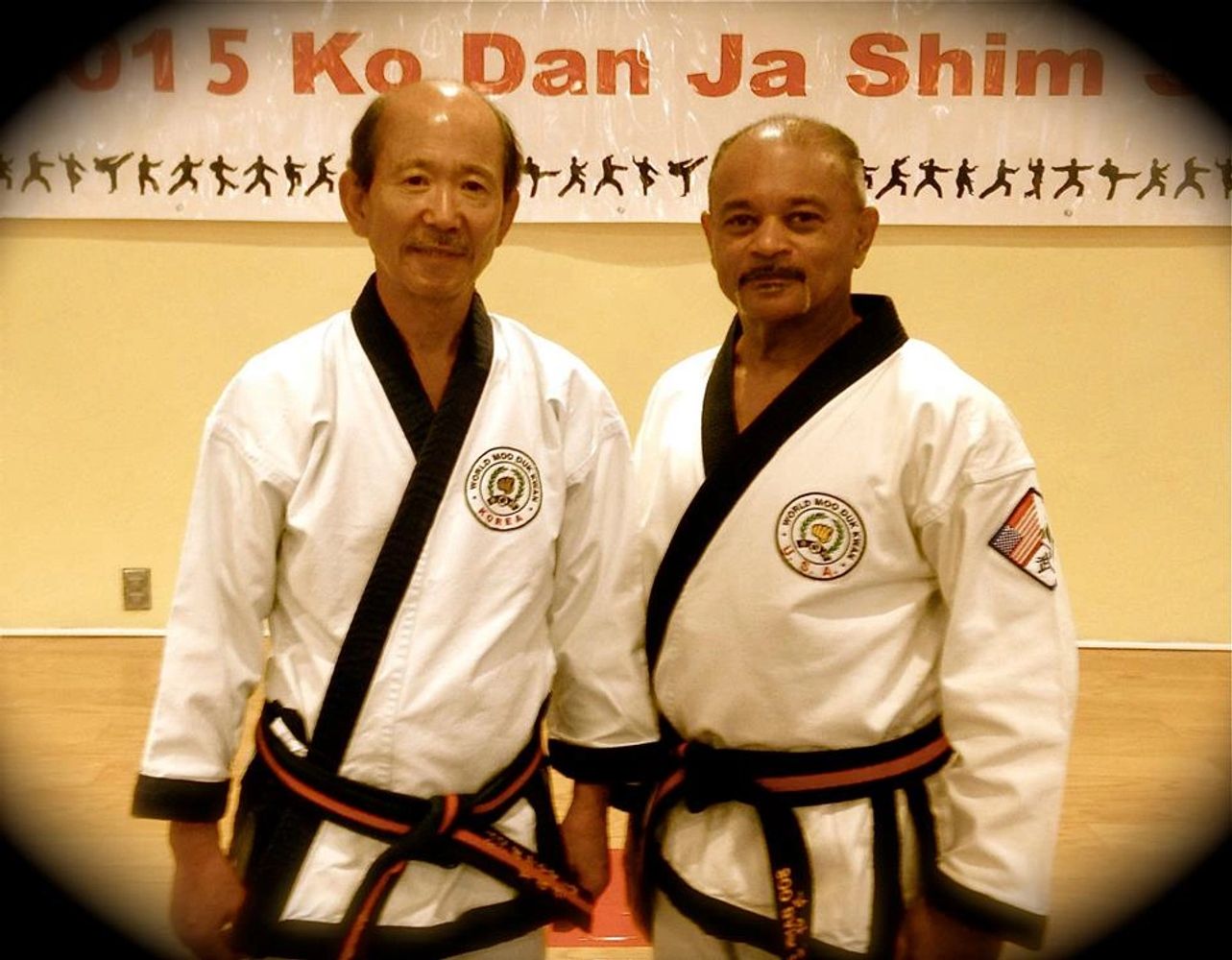 Photo features World Federation President and Grandmaster H.C. Hwang and Master Darno DeJohnette.