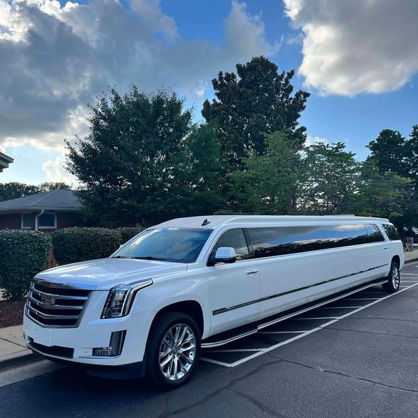 A premium white Cadillac Escalade stretch limo with a capacity of 16 passengers