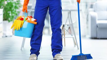 Cleaner holding bucket and mop.