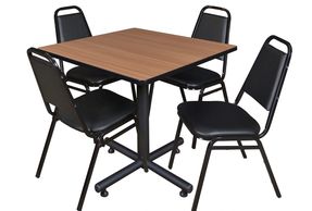 Chairs and a table similar to what might be seen in an office break room or lunch area.