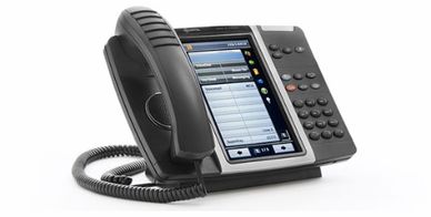 Picture of an average multi-line office phone that can be seen on most desks that we clean in San An