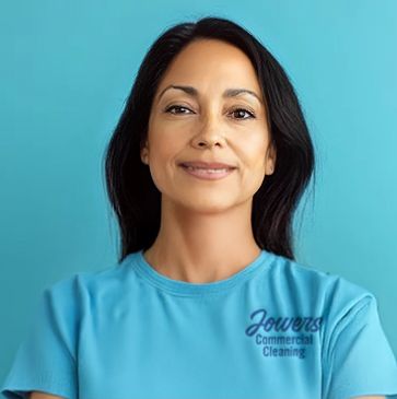 Female in a t-shirt with Jowers Commercial Cleaning logo. She appears happy and is facing the viewer