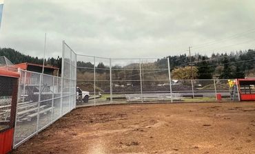Chain link fencing for backstop at a baseball field