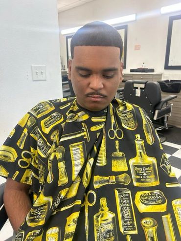 Groomed man post haircut sitting in barber shop
