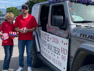 John with his youngest son, Deke, waiting to walk in Plains Days parade 6/7/25