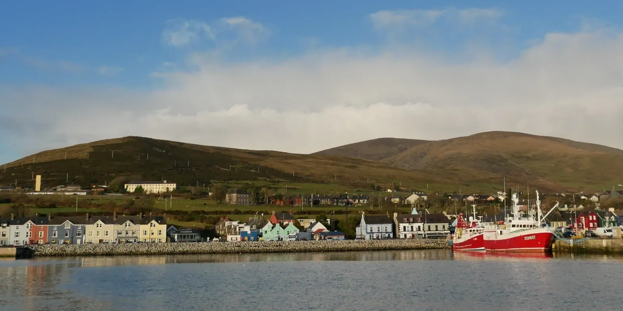 A short stroll away mountains embrace Dingle harbour. Boats bring fresh fish to the locality.