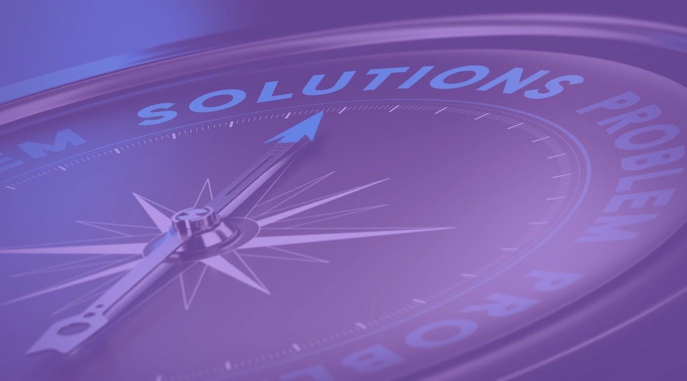 Compass pointing to the word 'SOLUTIONS'.