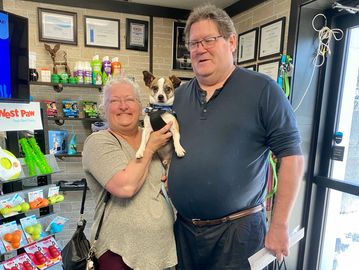 Rocky and his new forever.family pose for a quick picture before getting back on the road.