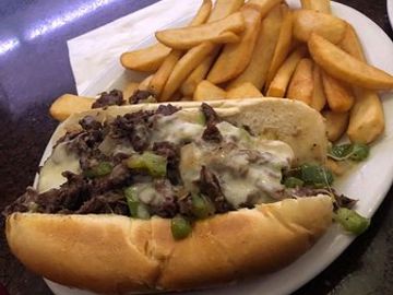 Thinly slice rib-eye steak, Sauteed peppers, mushrooms & onion topped w. melted provolone cheese.