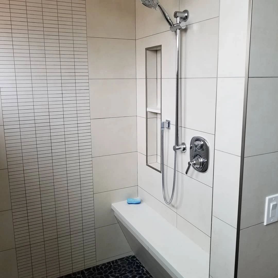 White tile with accent mosaic