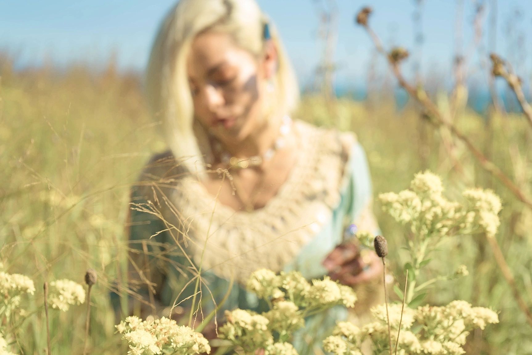 Girl in field of flowers in the summer