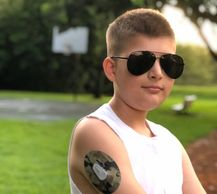 Type 1 Diabetic kid wearing a Dexcom CGM device