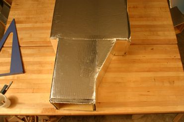 A picture of a duct board fitting made easy.