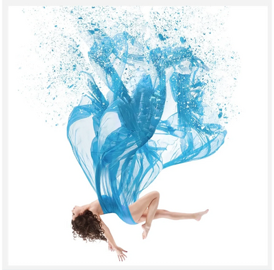 Woman floating with a flowing blue dress blending into paint splashes.