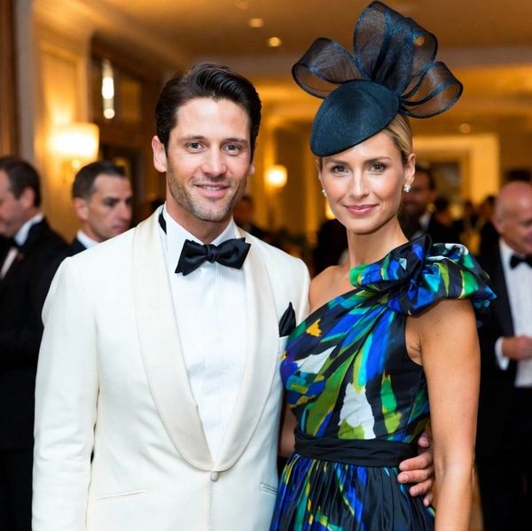 At the elegant Black-tie event, attractive man and woman present.