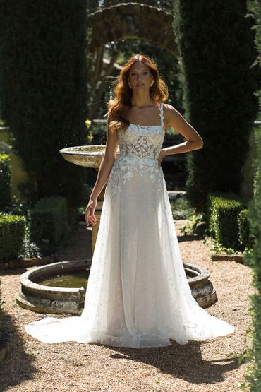 fitted white bridal gown with sheer lace details