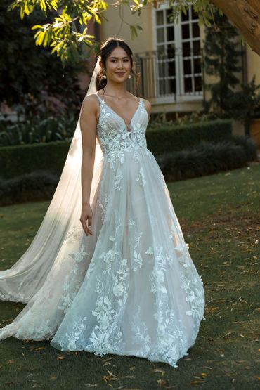 white tulle bridal gown with floral lace accents