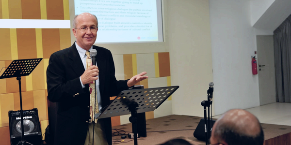 Robert giving a lecture to an audience