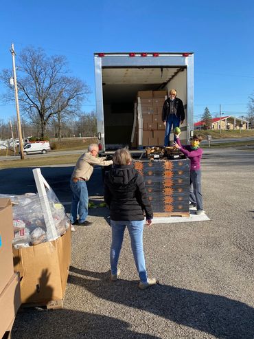 Unloading a pallet of food.