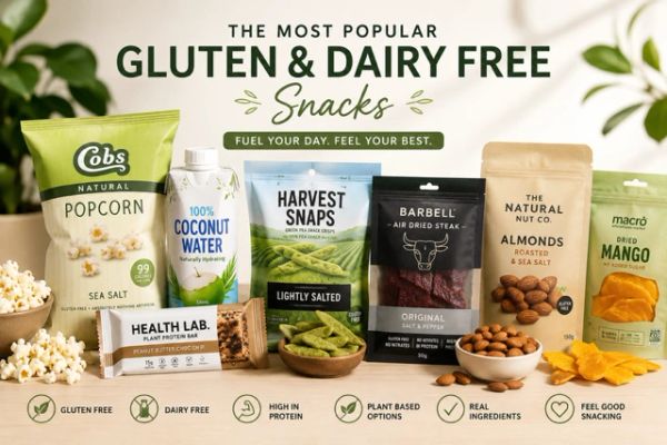 Variety of gluten- and dairy-free snacks including popcorn, coconut water, protein bars, and nuts.