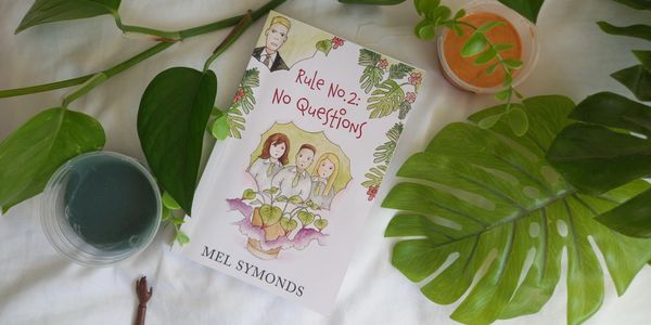 Book Rule No.2: No Questions with plants, coloured slime and a hand